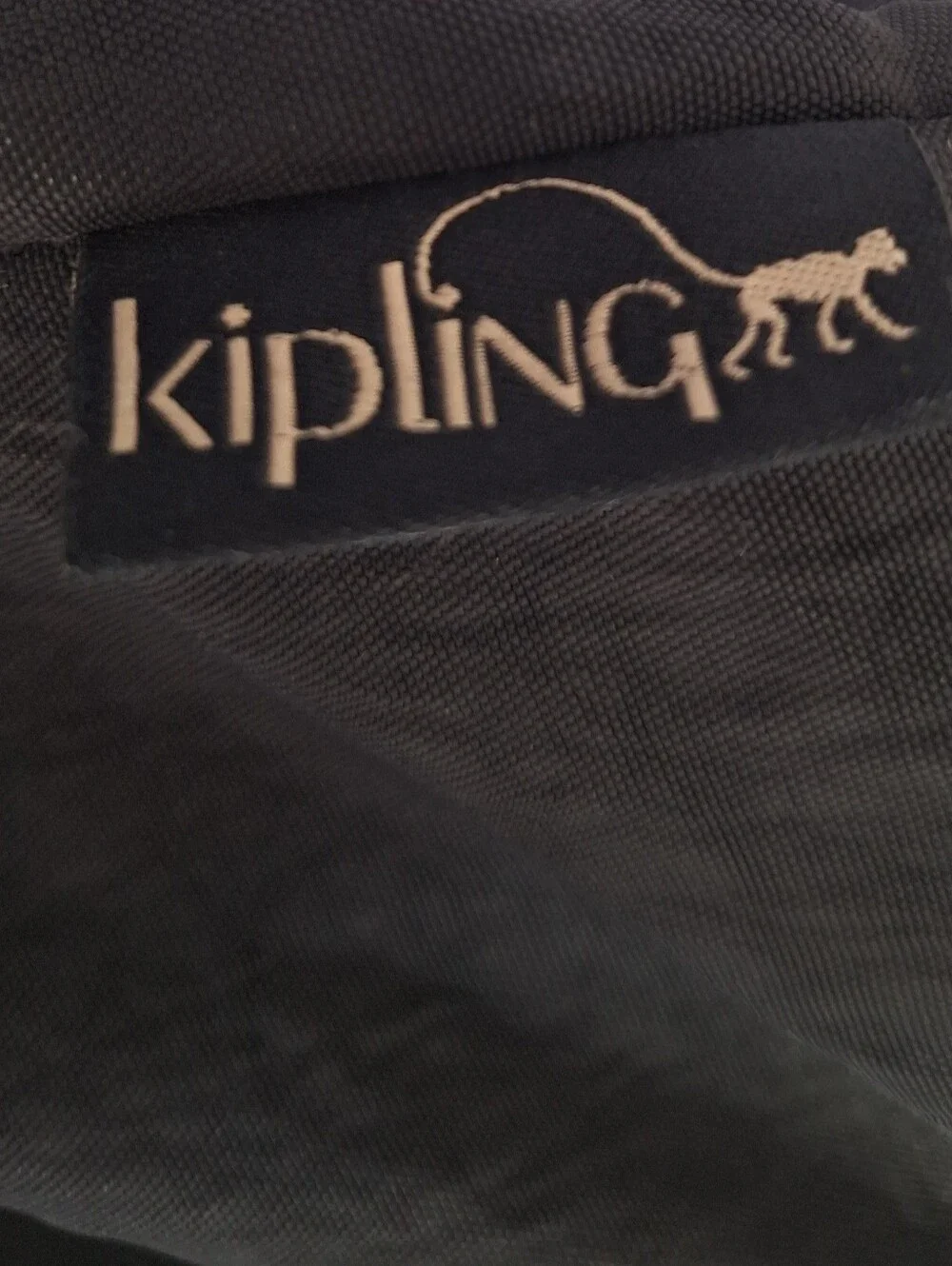 Kipling Black Canvas Drawstring Backpack with Handle And Front Zip Pockets